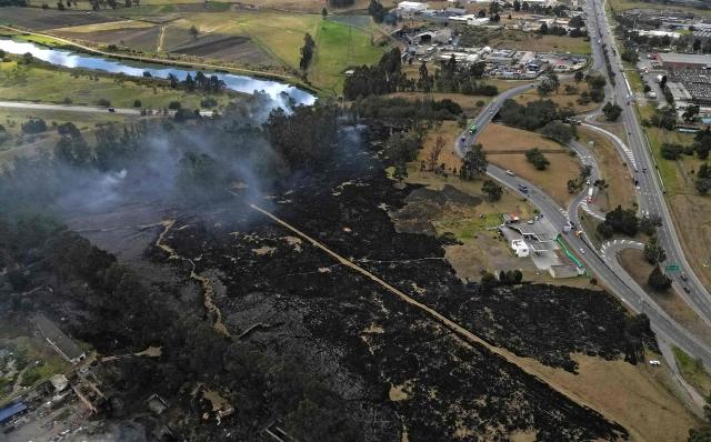 Aerial view showing a wildfire amid high temperatures in Sibate, near Bogota, Colombia, on August 3, 2026. (Photo by Raul ARBOLEDA / AFP)