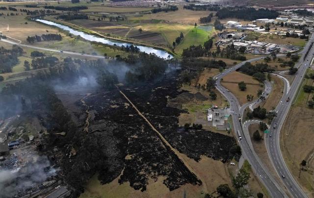 Aerial view showing a wildfire amid high temperatures in Sibate, near Bogota, Colombia, on August 3, 2026. (Photo by Raul ARBOLEDA / AFP)