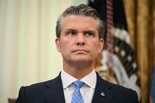 US Defense Secreatry Pete Hegseth looks on before President Donald Trump signs an executive order in the Oval Office of the White House in Washington, DC, on August 3, 2026. (Photo by Jim WATSON / AFP)