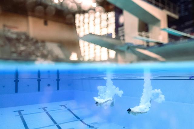 Germany's diver Lou Noel Guy Massenberg and Jonathan Gisbert Schauer compete in the men’s 3m springboard synchro final diving event during the LEN European Aquatics Championships, at the Olympic Aquatics Centre in Saint-Denis, northeastern suburbs of Paris, on August 3, 2026. (Photo by SEBASTIEN BOZON / AFP)