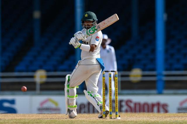 Babar Azam of Pakistan hits 4 during the second day of the second Test match between West Indies and Pakistan at Queen's Park Oval in Port of Spain, Trinidad and Tobago, on August 3, 2026. (Photo by Randy Brooks / AFP)