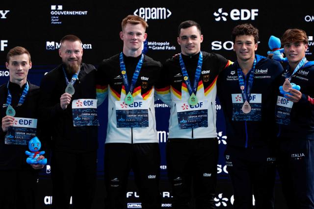 (LtoR) Silver medallists Neutral Athletes Evgenii Kuznetsov and Nikita Shleikher, Gold medallists Germany's divers Lou Noel Guy Massenberg and Jonathan Giesbert Schauer and Bronze medallists pose on the podium after the men’s 3m springboard synchro final diving event during the LEN European Aquatics Championships, at the Olympic Aquatics Centre in Saint-Denis, northeastern suburbs of Paris, on August 3, 2026. (Photo by Dimitar DILKOFF / AFP)