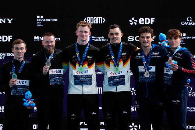 (LtoR) Silver medallists Neutral Athletes Evgenii Kuznetsov and Nikita Shleikher, Gold medallists Germany's divers Lou Noel Guy Massenberg and Jonathan Giesbert Schauer and Bronze medallists pose on the podium after the men’s 3m springboard synchro final diving event during the LEN European Aquatics Championships, at the Olympic Aquatics Centre in Saint-Denis, northeastern suburbs of Paris, on August 3, 2026. (Photo by Dimitar DILKOFF / AFP)