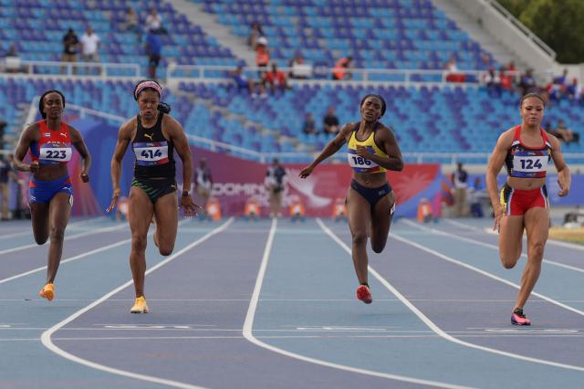 (L to R) Cuba's Yunisleidy Garcia, Jamaica's Natasha Morrison, Colombia's Maria Maturana and Antigua and barbuda's Geolyna Dowdy compete in the women's 100m semifinal, heat 2, during the XXV Central American and Caribbean Games at the Felix Sanchez Olympic Stadium in Santo Domingo on August 3, 2026. (Photo by Francesco SPOTORNO / AFP)