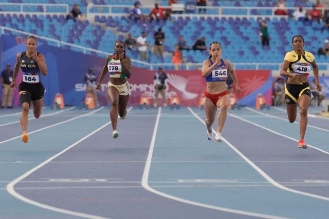 (L to R) Venezuela's Orangys Jimenez, Guyana's Juvonna Cornette, Puerto Rico's Gladymar Torres and Jamaica's Krystal Sloley compete in the women's 100m semifinal, heat 3, during the XXV Central American and Caribbean Games at the Felix Sanchez Olympic Stadium in Santo Domingo on August 3, 2026. (Photo by Francesco SPOTORNO / AFP)