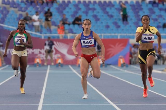 (L to R) Guyana's Juvonna Cornette, Puerto Rico's Gladymar Torres and Jamaica's Krystal Sloley compete in the women's 100m semifinal, heat 3, during the XXV Central American and Caribbean Games at the Felix Sanchez Olympic Stadium in Santo Domingo on August 3, 2026. (Photo by Francesco SPOTORNO / AFP)
