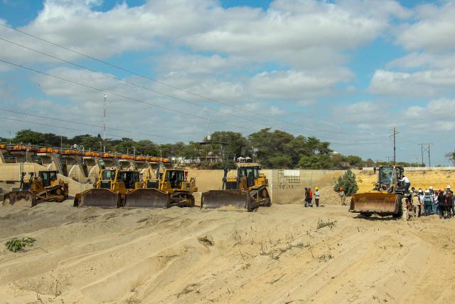 Peru's President Keiko Fujimori climbs into a backhoe during an inspection of cleaning and desilting work on the Piura River in the Piura Department, Peru, on August 3, 2026. Peru's President Keiko Fujimori visited the northern part of the country on August 3, where shelters will be set up and the infrastructure of schools and hospitals will be reinforced as part of prevention efforts ahead of the El Niño weather phenomenon, which continues to intensify in the Pacific. (Photo by Ralph Zapata / AFP)