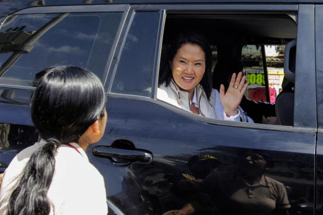 Peru's President Keiko Fujimori waves to a woman as she leaves after an inspection of cleaning and desilting work on the Piura River in the Piura Department, Peru, on August 3, 2026. Peru's President Keiko Fujimori visited the northern part of the country on August 3, where shelters will be set up and the infrastructure of schools and hospitals will be reinforced as part of prevention efforts ahead of the El Niño weather phenomenon, which continues to intensify in the Pacific. (Photo by Ralph Zapata / AFP)