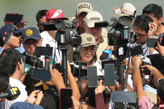 Peru's President Keiko Fujimori (C) speaks to the press during an inspection of cleaning and desilting work on the Piura River in the Piura Department, Peru, on August 3, 2026. Peru's President Keiko Fujimori visited the northern part of the country on August 3, where shelters will be set up and the infrastructure of schools and hospitals will be reinforced as part of prevention efforts ahead of the El Niño weather phenomenon, which continues to intensify in the Pacific. (Photo by Ralph Zapata / AFP)