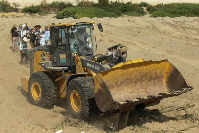 Peru's President Keiko Fujimori is seen inside a backhoe during an inspection of cleaning and desilting work on the Piura River in the Piura Department, Peru, on August 3, 2026. Peru's President Keiko Fujimori visited the northern part of the country on August 3, where shelters will be set up and the infrastructure of schools and hospitals will be reinforced as part of prevention efforts ahead of the El Niño weather phenomenon, which continues to intensify in the Pacific. (Photo by Ralph Zapata / AFP)