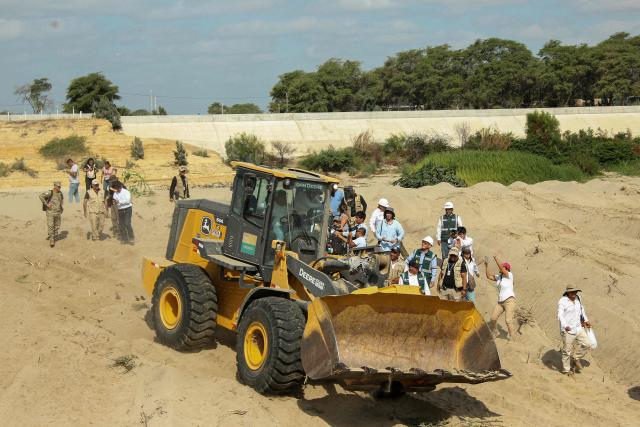 Peru's President Keiko Fujimori is seen inside a backhoe during an inspection of cleaning and desilting work on the Piura River in the Piura Department, Peru, on August 3, 2026. Peru's President Keiko Fujimori visited the northern part of the country on August 3, where shelters will be set up and the infrastructure of schools and hospitals will be reinforced as part of prevention efforts ahead of the El Niño weather phenomenon, which continues to intensify in the Pacific. (Photo by Ralph Zapata / AFP)