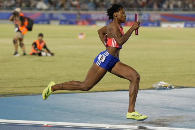 Dominican Republic's Marileydi Paulino competes in the 4 x 400m relay mixed final event during the XXV Central American and Caribbean Games at the Felix Sanchez Olympic Stadium in Santo Domingo on August 3, 2026. (Photo by Francesco SPOTORNO / AFP)