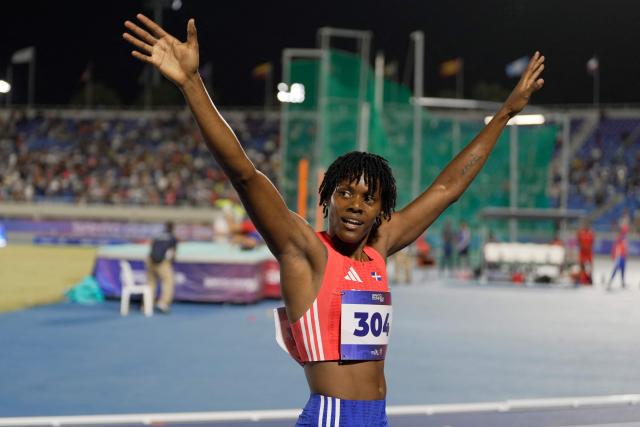 Dominican Republic's Marileydi Paulino gestures after competing in the 4 x 400m relay mixed final event during the XXV Central American and Caribbean Games at the Felix Sanchez Olympic Stadium in Santo Domingo on August 3, 2026. (Photo by Francesco SPOTORNO / AFP)