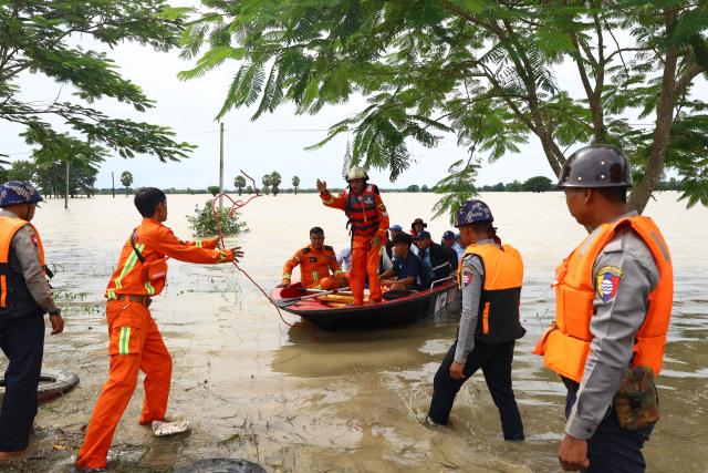 Rescue workers prepare a boat to help residents affected by flooding in Lemyethna in Myanmar's Irrawaddy Delta region on August 3, 2026. (Photo by AFP)