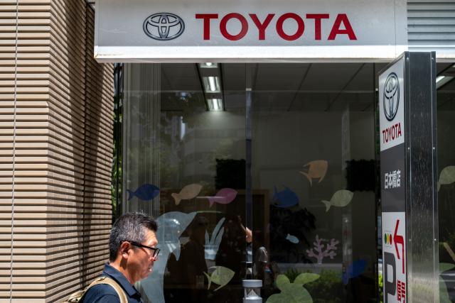 A Toyota logo is seen on the side of a store in Tokyo on August 4, 2026. (Photo by Philip FONG / AFP)