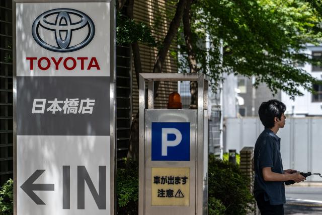 A Toyota logo is seen on the side of a store in Tokyo on August 4, 2026. (Photo by Philip FONG / AFP)