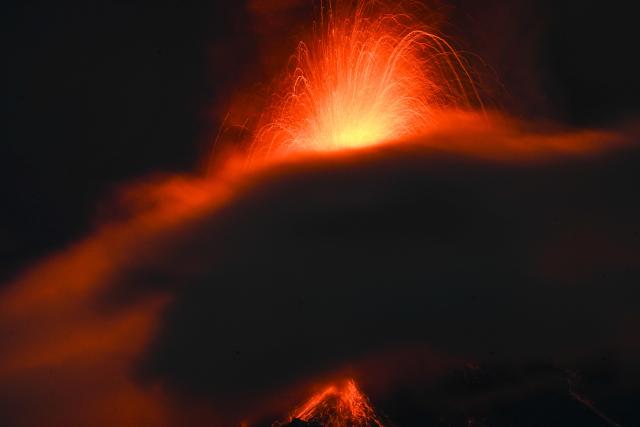 The Fuego volcano erupts 65 kilometers southwest of Guatemala City on August 3, 2026. On Monday, Guatemalan authorities declared a “danger” alert, the second-highest level, due to a powerful eruption of the Fuego volcano, and began evacuating nearby hamlets. (Photo by Johan ORDONEZ / AFP)