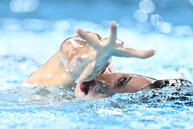 Spain's artistic swimmer Iris Tio Casas competes in the women’s solo technical artistic swimming final event during the LEN European Aquatics Championships, at the Olympic Aquatics Centre in Saint-Denis, northeastern suburbs of Paris, on August 4, 2026. (Photo by JULIEN DE ROSA / AFP)