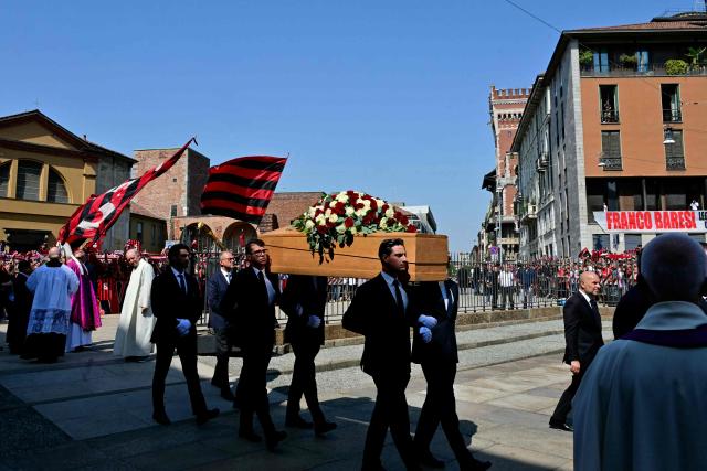 Pallbearers carry the coffin of late AC Milan football player Franco Baresi outside the Sant’Ambrogio Basilica before the funeral in Milan on August 4, 2026. (Photo by Stefano RELLANDINI / AFP)