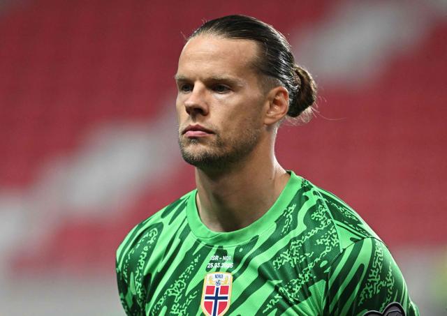 (FILES) Norway's goalkeeper #01 Orjan Nyland lines up for the national anthems prior to the 2026 World Cup Group I qualifier football match between Israel and Norway in Debrecen, Hungary, on March 25, 2025. RB Leipzig have signed Orjan Nyland, the club announced on August 4, 2026. The 35-year-old joins German first division club RB Leipzig on a free transfer after his contract with FC Sevilla expired and will wear the jersey number 1. The goalkeeper was previously under contract with RB Leipzig in the 2022/23 season. (Photo by Attila KISBENEDEK / AFP)