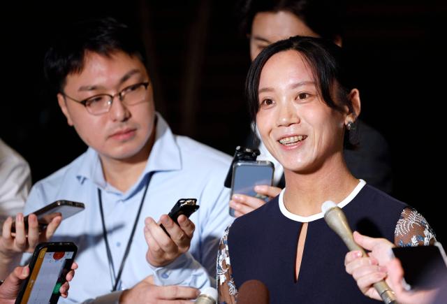 Japanese speed skater Miho Takagi speaks to reporters after receiving the People's Honor Award at the prime minister's office in Tokyo on August 4, 2026. (Photo by Franck ROBICHON / POOL / AFP)