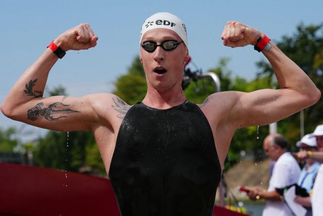 Germany's swimmer Florian Wellbrock celebrates winning the men's 10km open water swimming event during the LEN European Aquatics Championships, in the Seine River in Paris, on August 4, 2026. (Photo by Dimitar DILKOFF / AFP)