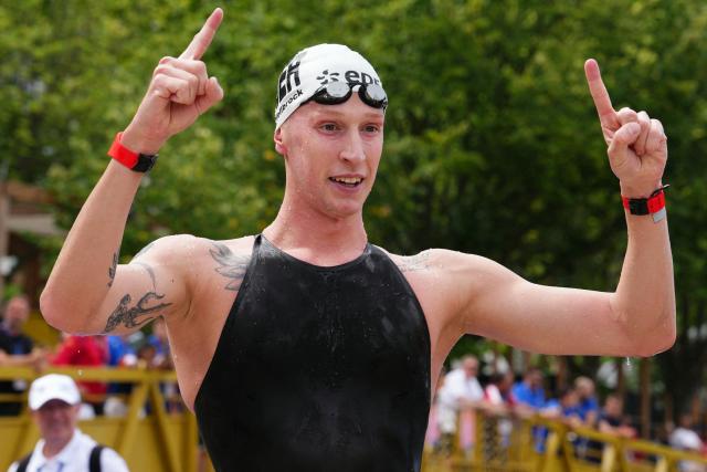 Germany's swimmer Florian Wellbrock celebrates winning the men's 10km open water swimming event during the LEN European Aquatics Championships, in the Seine River in Paris, on August 4, 2026. (Photo by Dimitar DILKOFF / AFP)