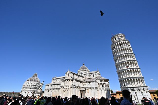 (FILES) A picture shows the Baptistery (L), the Duomo (C) and the Tower of Pisa, at Piazza dei Miracoli, in Pisa, Tuscany, on April 19,  2024. An earthquake with a magnitude of 4.3 hit the Tuscan area around Pisa in central Italy, authorities said on August 4, 2026. The quake, which struck at 10:15am local time (0815 GMT), was centred some 7 kilometres west of Pisa, Italy's National Institute of Geophysics and Volcanology (INGV) said. (Photo by Andreas SOLARO / AFP)