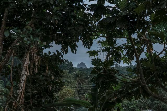 A general view of Pico Papagaio, near Santo Antonio city, in Principe Island in Sao Tome and Principe on August 3, 2026. Pico Papagaio is a hill in Sao Tome and Principe, situated roughly in the centre of the island of Principe. This geological formation rises to an altitude of 680 metres. (Photo by Daniel BELOUMOU OLOMO / AFP)