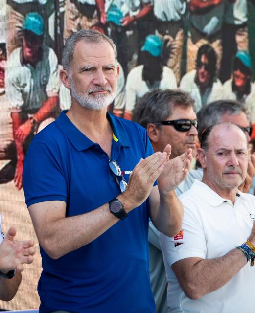 Spain's King Felipe VI (3L) applauds in tribute to two sailors who died during at the 44th Copa del Rey (King's Cup) regatta in Palma de Mallorca, on August 4, 2026. (Photo by JAIME REINA / AFP)