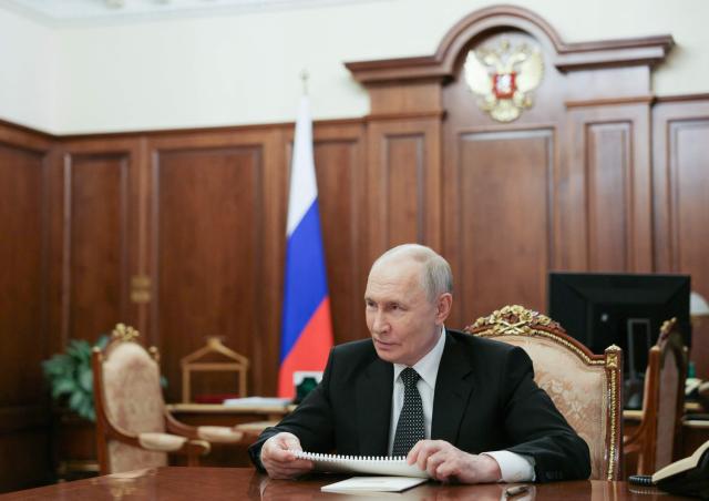 In this pool photograph distributed by the Russian state agency Sputnik, Russia's President Vladimir Putin attends a meeting with chief executive officer of Russia's state-run diamond giant Alrosa in Moscow on August 4, 2026. (Photo by Alexander KAZAKOV / POOL / AFP)