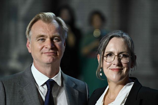 British-American filmmaker Christopher Nolan poses with his wife and producer Emma Thomas at a red carpet event for the film 'The Odyssey' in Seoul on August 4, 2026, ahead of its opening on August 5. (Photo by GREG BAKER / AFP)