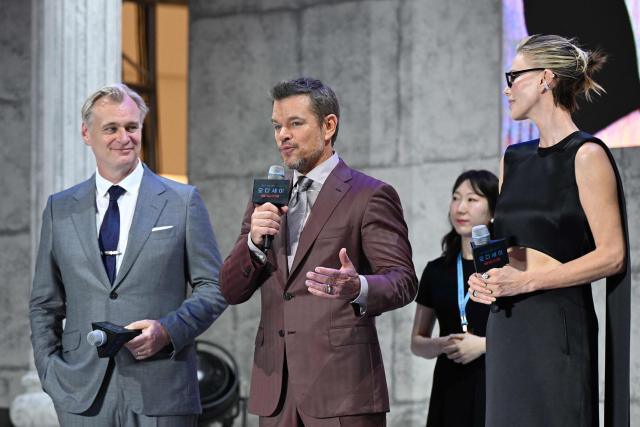 US actor Matt Damon (C) speaks at a red carpet event for the film 'The Odyssey' alongside South African-US actress Charlize Theron and British-American film maker Christopher Nolan in Seoul on August 4, 2026, ahead of its opening on August 5. (Photo by GREG BAKER / AFP)