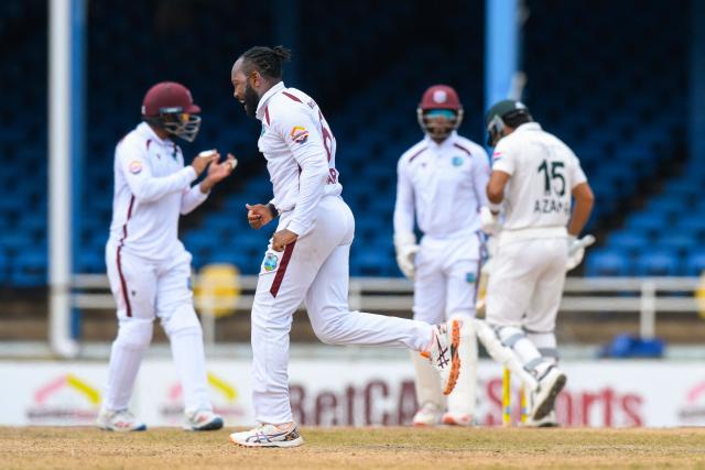 Jomel Warrican (2L) of West Indies celebrates the dismissal of Muhammad Awais Zafar (R) of Pakistan during the third day of the second Test match between West Indies and Pakistan at Queen's Park Oval in Port of Spain, Trinidad and Tobago, on August 4, 2026. (Photo by Randy Brooks / AFP)