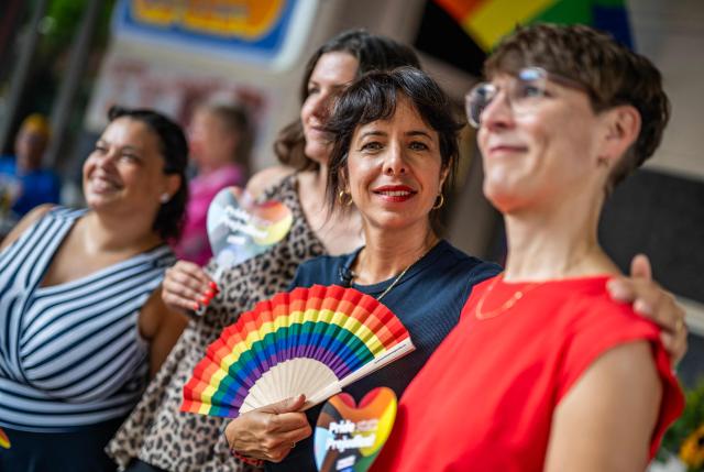 The Left Party's (Die Linke) main candidate in upcoming regional elections in Berlin Elif Eralp (2nd from R) poses for a picture at a cafe during a campaign stop in Berlin's Schoeneberg district on August 4, 2026. Berlin goes to the polls on September 20, 2026. (Photo by John MACDOUGALL / AFP)