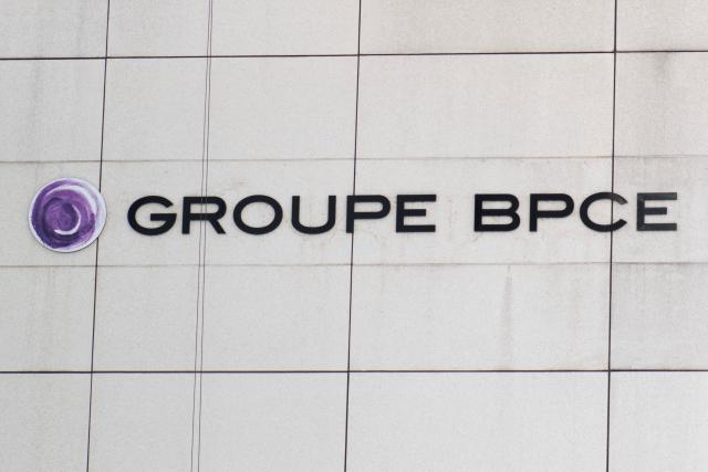 (FILES) This photograph shows the logo of the BPCE group, a French banking group, on a building facade in Charenton-le-Pont, on June 17, 2025. French banking group BPCE saw its profits jump 38% in the second quarter, to 1.3 billion euros, driven by its retail banking networks in France and by the integration of Portuguese bank Novobanco, according to a statement released on August 4, 2026. (Photo by Martin LELIEVRE / AFP)