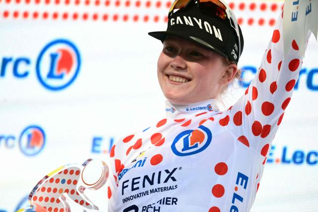Fenix-Deceuninck's Dutch rider Puck Pieterse celebrates on the podium with the best climber's polka dot (dotted) jersey after the individual time-trial in the 4th (out of 9) stage of the fifth edition of the Women's Tour de France cycling race, 21 km time trial between Gevrey-Chambertin and Dijon, in Dijon, eastern France on August 4, 2026. (Photo by NICOLAS TUCAT / AFP)