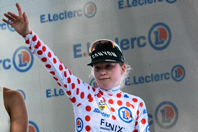 Fenix-Deceuninck's Dutch rider Puck Pieterse celebrates on the podium with the best climber's polka dot (dotted) jersey after the individual time-trial in the 4th (out of 9) stage of the fifth edition of the Women's Tour de France cycling race, 21 km time trial between Gevrey-Chambertin and Dijon, in Dijon, eastern France on August 4, 2026. (Photo by NICOLAS TUCAT / AFP)