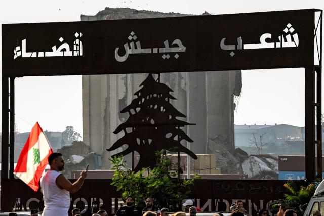 Family members and relatives of the victims of the 2020 Beirut port explosion gather for an event commemorating the sixth anniversary of the incident outside the port area in Beirut on August 4, 2026. The massive Beirut port explosion on August 4, 2020, killed more than 220 people, injured more that 6,500 and damaged swathes of the capital. Lebanese authorities have said the explosion was triggered by a fire in a warehouse where tonnes of ammonium nitrate fertiliser had been stored haphazardly for years, despite repeated warnings to senior officials. (Photo by Joseph EID / AFP)