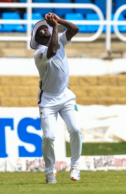 Kemar Roach of West Indies takes the catch to dismiss Ali Usman of Pakistan during the third day of the second Test match between West Indies and Pakistan at Queen's Park Oval in Port of Spain, Trinidad and Tobago, on August 4, 2026. (Photo by Randy Brooks / AFP)