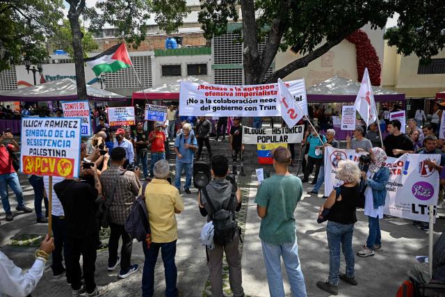 Members of the Communist Party of Venezuela (PCV) take part in a protest against US interference in Venezuela at El Venezolano Square in Caracas on August 4, 2026. (Photo by Federico PARRA / AFP)