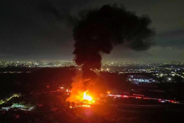 This aerial view shows a large fire at a chemical plant in Itaquaquecetuba, Sao Paulo state, Brazil, on August 4, 2026. (Photo by Miguel SCHINCARIOL / AFP)