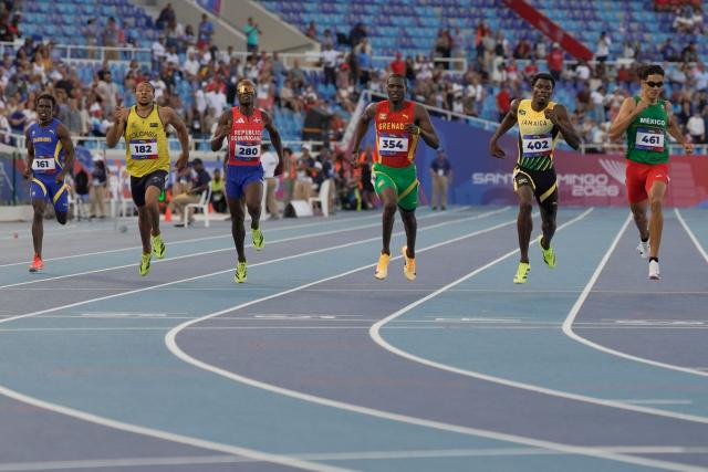 (L to R) Barbados' Aren Spencer, Colomba's Jhonatan Julio, Dominican Republic's Lidio Andres Feliz, Grenada's Kirani James, Jamaica's Javeir Brown and Mexico's Valente Mendoza compete in the men's 400m semifinal, heat 2, during the XXV Central American and Caribbean Games at the Felix Sanchez Olympic Stadium in Santo Domingo on August 3, 2026. (Photo by Francesco SPOTORNO / AFP)