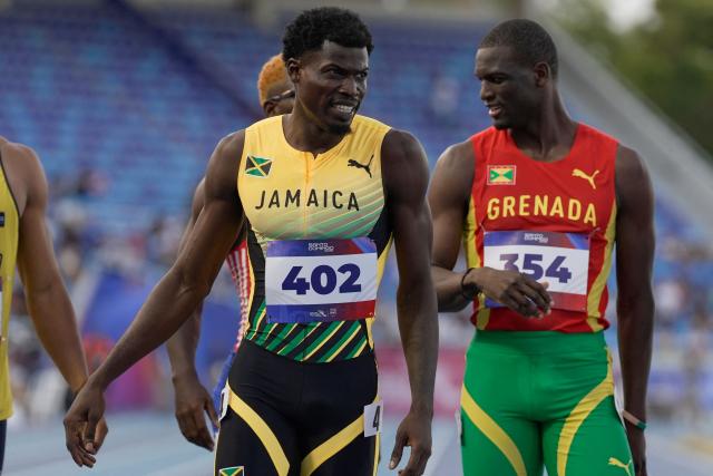 Jamaica's Javeir Brown looks on next to Grenada's Kirani James after competing in the men's 400m semifinal, heat 2, during the XXV Central American and Caribbean Games at the Felix Sanchez Olympic Stadium in Santo Domingo on August 3, 2026. (Photo by Francesco SPOTORNO / AFP)