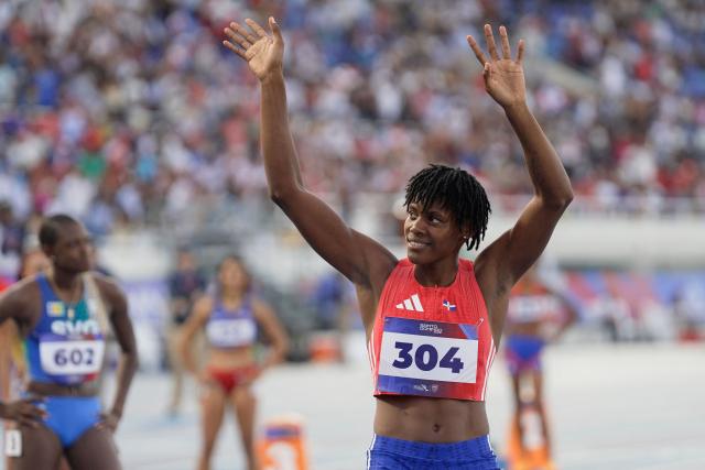 Dominican Republic's Marileidy Paulino waves before competing in the women's 400m semifinal, heat 1, during the XXV Central American and Caribbean Games at the Felix Sanchez Olympic Stadium in Santo Domingo on August 3, 2026. (Photo by Francesco SPOTORNO / AFP)