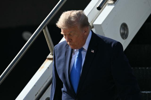 US President Donald Trump steps off Air Force One upon arrival at Los Angeles International Airport in Los Angeles on August 4, 2026. US President Donald Trump will stop at his Trump National Golf Club Los Angeles before departing for Las Vegas, where he is expected to deliver remarks on August 5 at Red Rock Casino Resort & Spa in Summerlin, Nevada, promoting the administration's tax-cut policies, including the "no tax on tips" measure. (Photo by Jim WATSON / AFP)