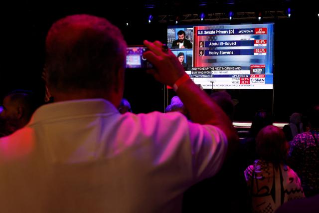 People watch early results during Democratic US Senate candidate Abdul El-Sayed's election night event at The Majestic Theatre in Detroit, Michigan, on August 4, 2026. El-Sayed is hoping to defeat US Representative Haley Stevens in the Democratic primary to advance to the general election in November. The candidates are vying for Michigan's US Senate seat to replace retiring Democratic Senator Gary Peters. (Photo by JEFF KOWALSKY / AFP)