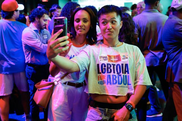 Attendees pose for a selfie during Democratic US Senate candidate Abdul El-Sayed's election night event at The Majestic Theatre in Detroit, Michigan, on August 4, 2026. El-Sayed is hoping to defeat US Representative Haley Stevens in the Democratic primary to advance to the general election in November. The candidates are vying for Michigan's US Senate seat to replace retiring Democratic Senator Gary Peters. (Photo by JEFF KOWALSKY / AFP)