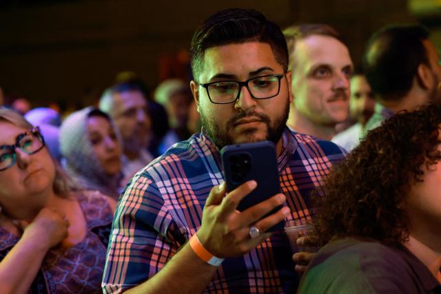Supporters watch election results during Democratic US Senate candidate Abdul El-Sayed's election night event at The Majestic Theatre in Detroit, Michigan, on August 4, 2026. El-Sayed is hoping to defeat US Representative Haley Stevens in the Democratic primary to advance to the general election in November. The candidates are vying for Michigan's US Senate seat to replace retiring Democratic Senator Gary Peters. (Photo by JEFF KOWALSKY / AFP)