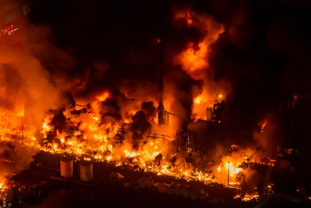 This aerial view shows a large fire at a chemical plant in the Quilicura commune of Santiago on August 4, 2026. (Photo by Javier TORRES / AFP)
